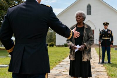 They saw an old woman in a worn coat and tried to remove her from a hero’s funeral. But two whispered words would change everything, revealing a secret buried deeper than any fallen soldier.