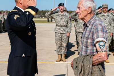 There are men who carry entire wars in the quiet of their hearts, hidden behind ordinary days and simple lives. This is the story of one such man, and the day a faded mark on his arm stopped a ceremony cold.